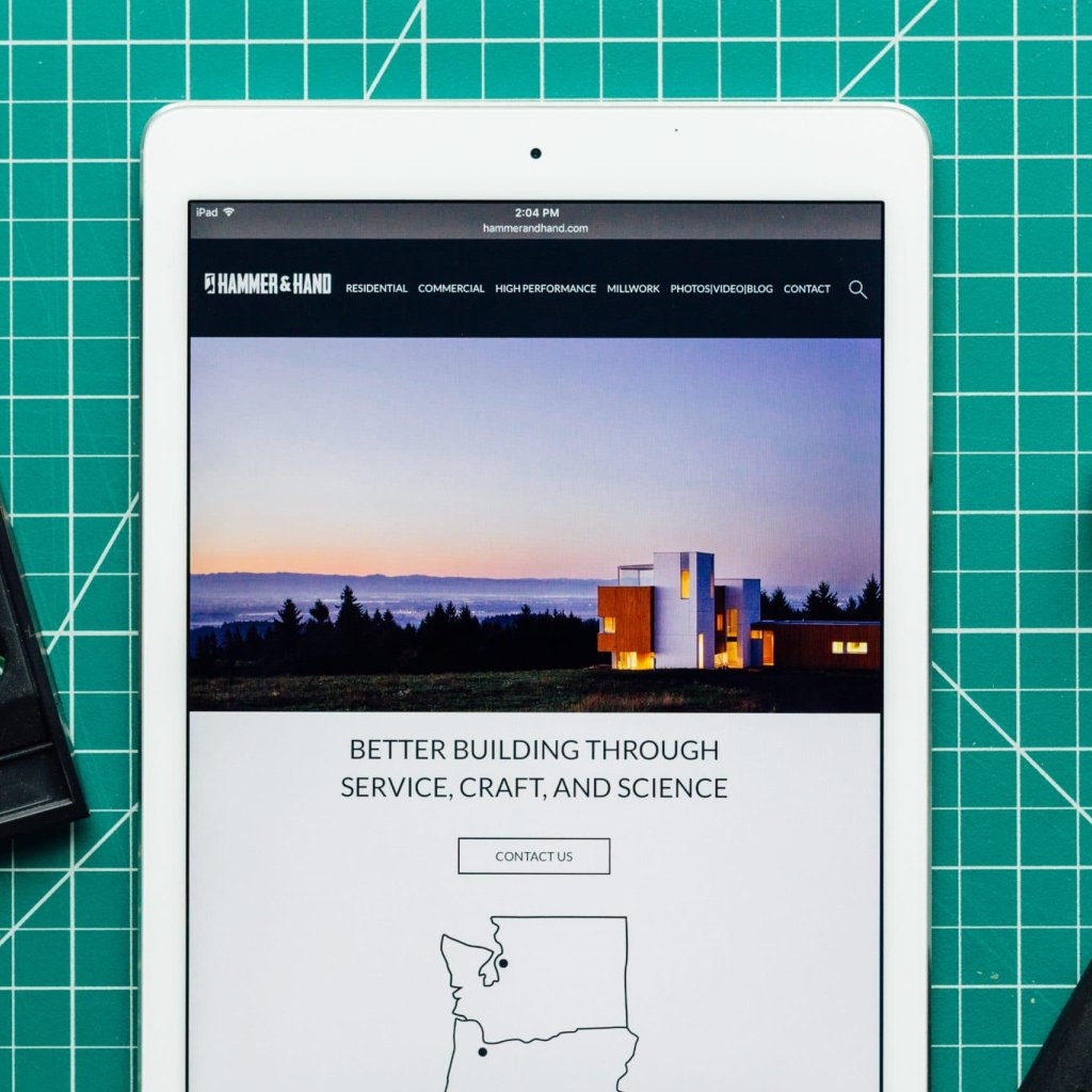 Hammer & Hand website showcased on an iPhone.