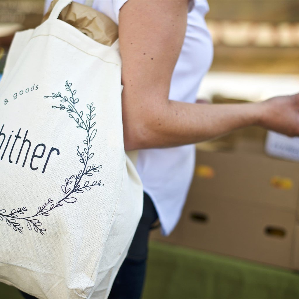 hither logo on a tote bag
