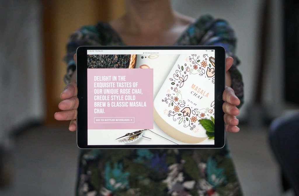 hands holding site on iPad