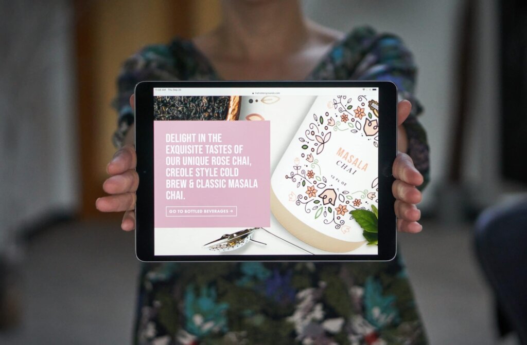 hands holding site on iPad