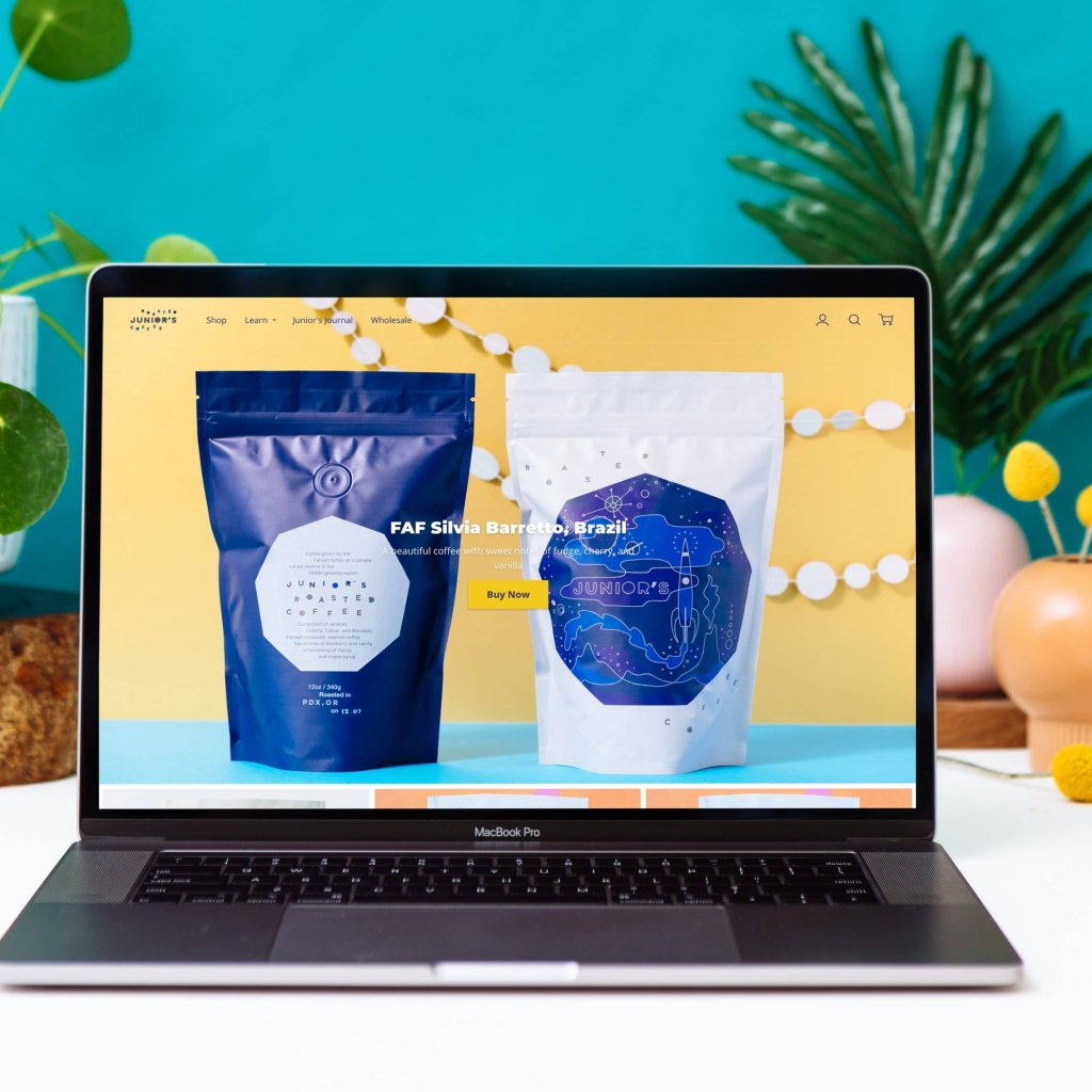 Home page of Junior's Roasted Coffee website featuring vibrant photography