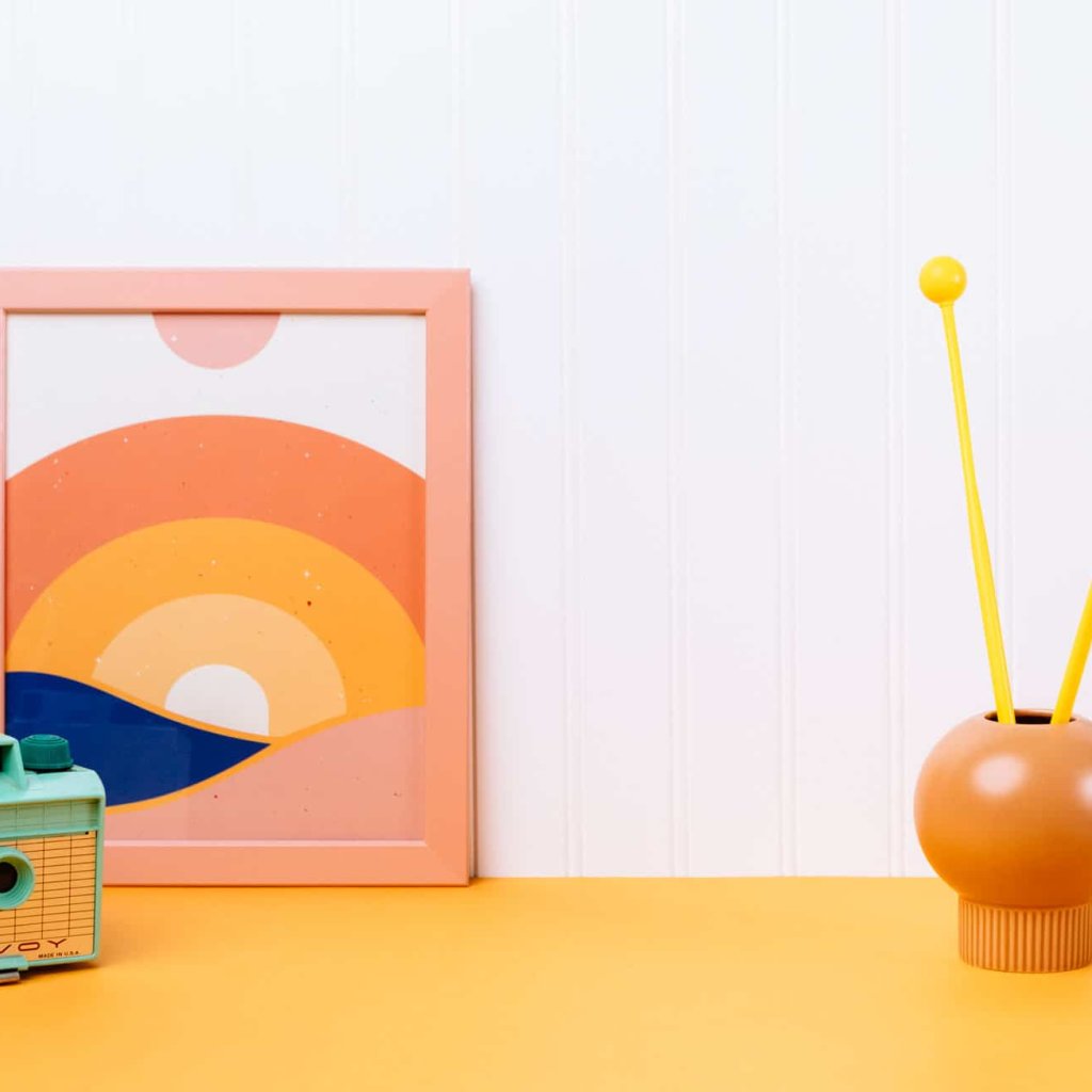 Playful lifestyle with a camera, poster and mallets
