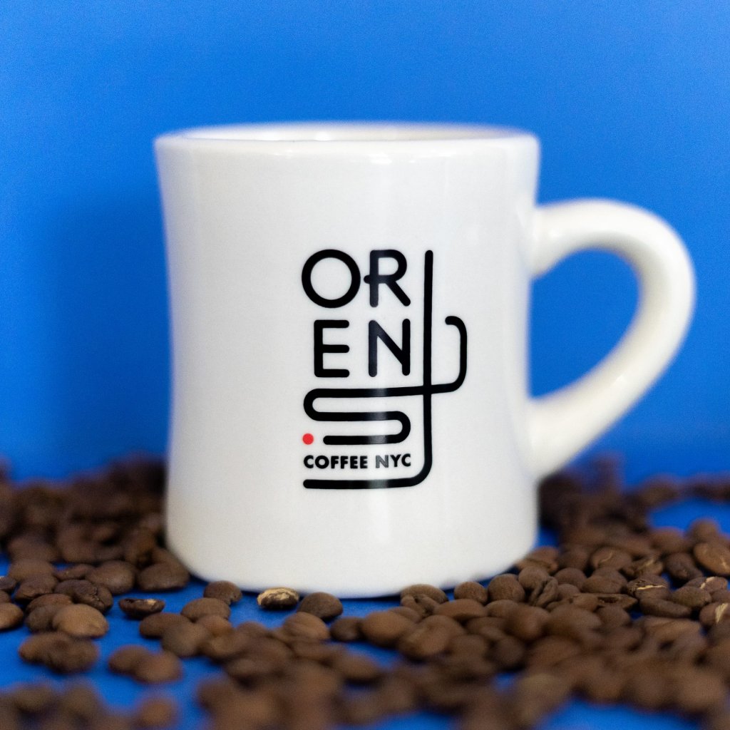 Up close view of a diner mug with the new Orens logo
