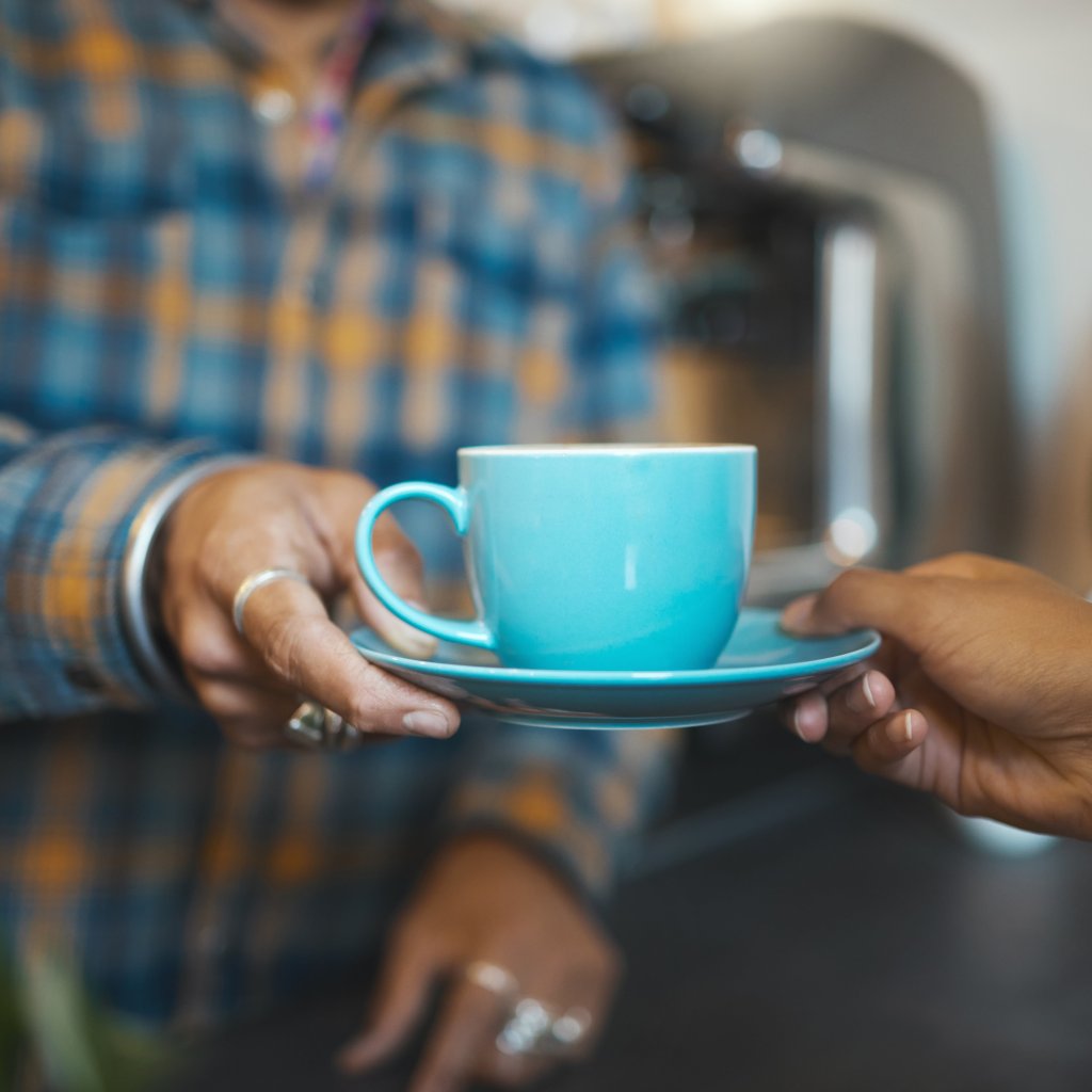 Customer service, cafe and hands of people with coffee for drinking, breakfast or lunch in restaurant
